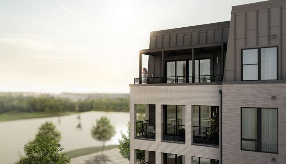 a rendering of a building with a lake in the backgroundat The Flats & Terraces at Wildhorse Village, Missouri