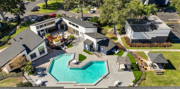 an aerial view of a house with a swimming pool