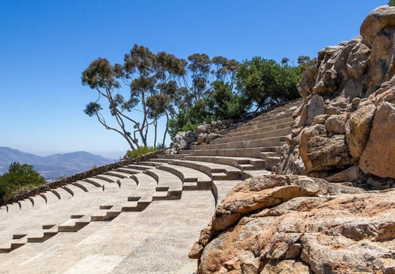 a staircase on a mountain with rocks and trees