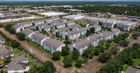 an aerial view of an apartment complex in the suburbs