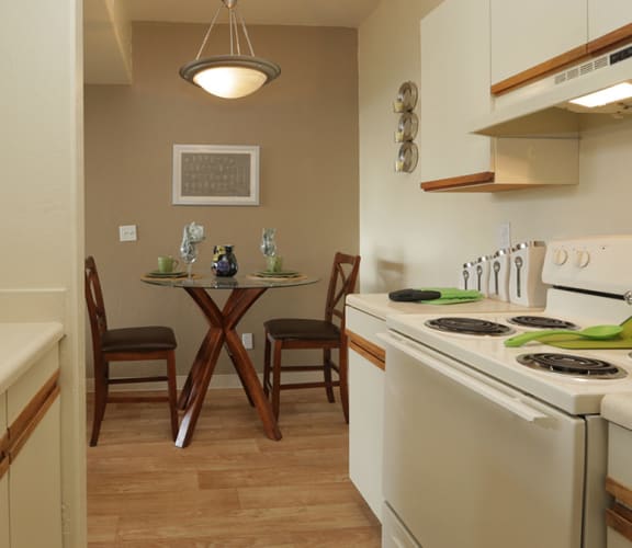 Springhill kitchen with wood flooring, cabinetry, and matching appliances