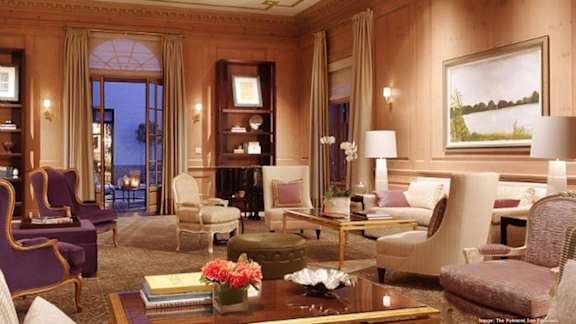 a living room filled with furniture and a large window
