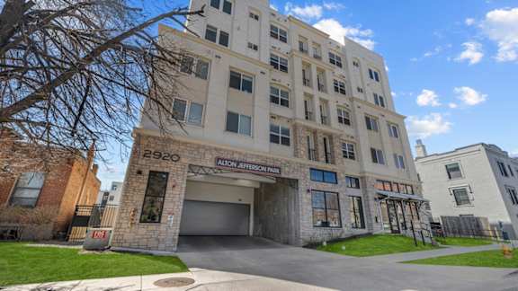 A large white building with the number 2920 and the words Alston Jeremiah Park on the front.