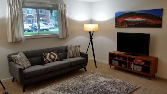 Scotsdale Lower Level Living Room 1 at Scotsdale Apartments, IA, 52241
