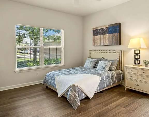a bedroom with a bed and a ceiling fan at Uphill Flats, Decatur, 30032