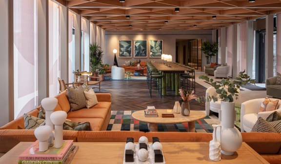 a living room with couches and chairs and a table