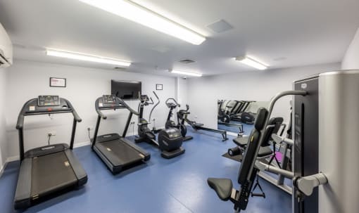 a room filled with lots of different types of exercise equipment
