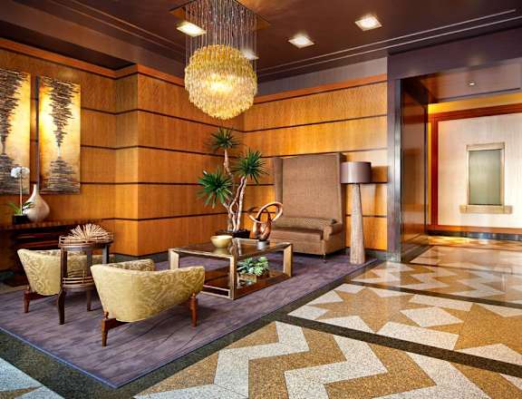 A living room with a brown and gold color scheme.