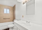 Thumbnail 7 of 9 - a bathroom with a sink and a toilet and a tub