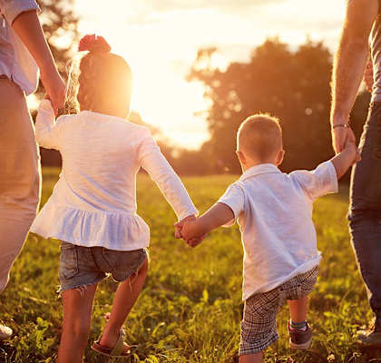 Lifestyle photo of family outside during the sunset at Marbrisa Apartments, Miami Gardens