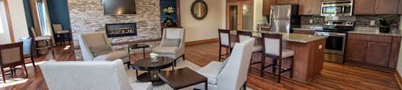 a living room with a kitchen and a dining room
