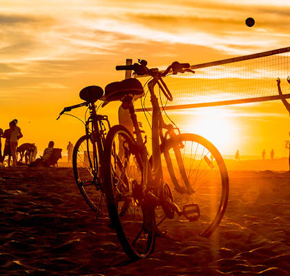 Lifestyle photo of volleyball and bikes on the beach at sunset at Preserve at Boynton Beach, Boynton Beach