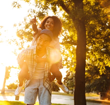 Lifestyle photo of couple at sunset at The Edge at Town Center Apartments, Jacksonville
