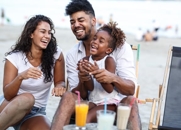 Lifestyle photo of family at the beach at Villa Hermosa, Miami, FL, 33174