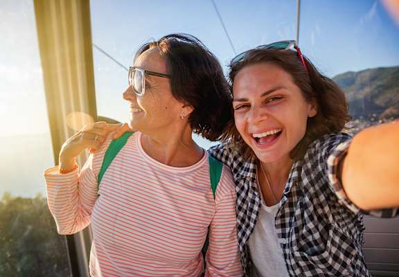 Lifestyle photo of mother and daughter having fun at Tuscany Place Apartments, Florida