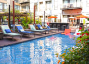 Thumbnail 8 of 17 - Pool With Sundecks at The Laurel Apartments, Saint Louis, MO