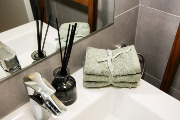 a pair of towels on a sink in a bathroom