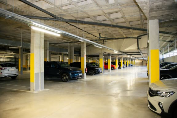 a parking garage with cars parked in it