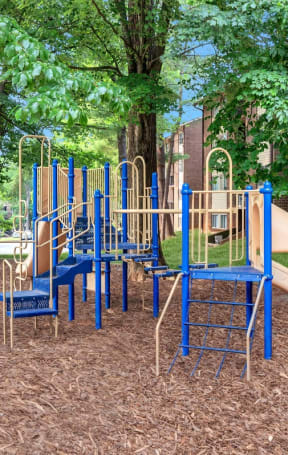 a playground with slides and chairs