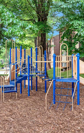 a playground with slides and chairs