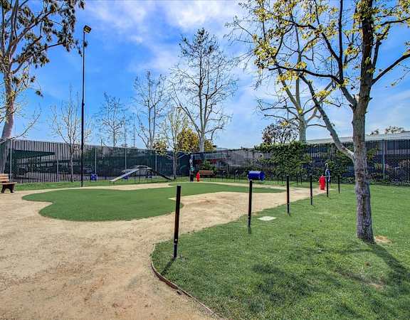 a park with a baseball field and a playground