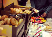 Thumbnail 3 of 9 - a table full of bagels and other food