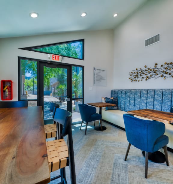 a living room filled with furniture and a large window