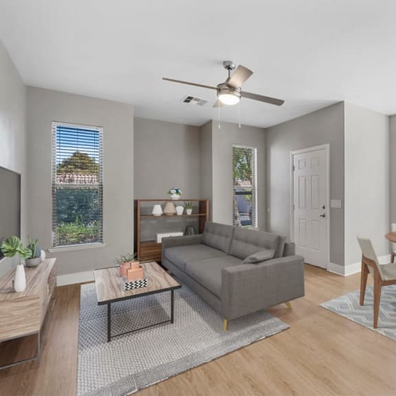 a living room and dining room with a couch and a table