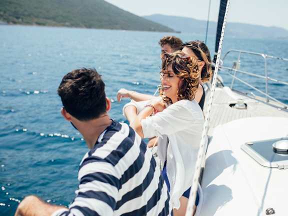 A family is enjoying a sail on a boat.