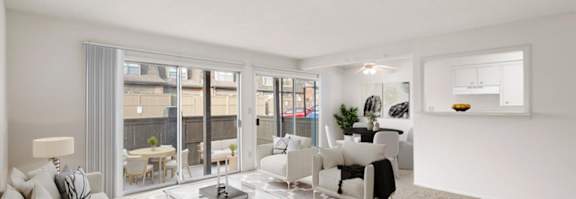 an open living room and dining room with sliding glass doors to a patio
