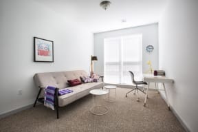 home office with desk, chair and couch