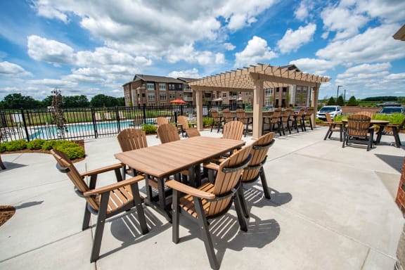 the reserve at the crossings patio table and chairs with pool and gazebo
