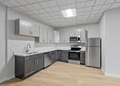 Thumbnail 1 of 4 - A kitchen with a refrigerator, oven, and sink at Hampton Plaza Apartments, Towson, MD, 21286