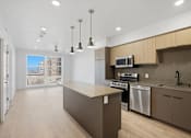 Thumbnail 10 of 51 - A kitchen with a stove, oven, and microwave at Brickside Heights, Millcreek