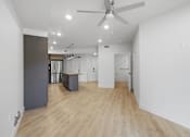 Thumbnail 30 of 51 - A room with a ceiling fan and wooden flooring at Brickside Heights, Millcreek, Utah