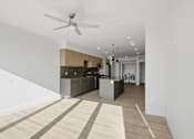Thumbnail 7 of 51 - A modern kitchen with a fan on the ceiling at Brickside Heights, Utah, 84106