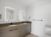 Thumbnail 27 of 51 - Bathroom with mirrors at Brickside Heights, Millcreek, UT
