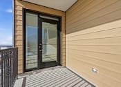 Thumbnail 41 of 51 - A modern house with a black door and a glass window at Brickside Heights, Millcreek, 84106