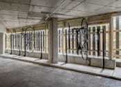 Thumbnail 5 of 8 - the inside of a building with bikes hanging on the wall