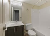 Thumbnail 1 of 13 - a bathroom with a sink toilet and bathtub at Copper and Quarry Village, Pikesville, 21209