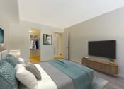 Thumbnail 10 of 13 - a bedroom with a bed and a tv at Copper and Quarry Village, Pikesville, MD, 21209