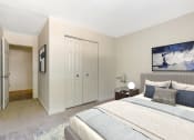 Thumbnail 8 of 13 - a bedroom with a large bed and two closets at Copper and Quarry Village, Pikesville, MD, 21209