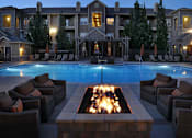 Thumbnail 10 of 17 - Poolside Seating and Fire Pit at Apartments Near Park Meadows Mall Colorado