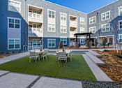 Thumbnail 18 of 19 - Outdoor Picnic Area at CO Springs Apartments Near Garden of the Gods Park