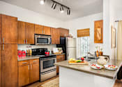 Thumbnail 4 of 16 - Highland Drive Apartments with Full Kitchen with Microwave and Dishwasher