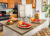 Thumbnail 5 of 16 - Kitchen with Stainless Steel Appliances at Midvale UT Apartments