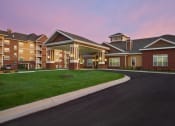 Thumbnail 47 of 49 - Exterior at twilight at Skye at Arbor Lakes Apartments, Maple Grove, Minnesota