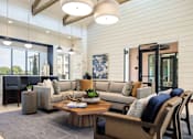 Thumbnail 22 of 25 - Elegant resident lounge featuring soaring ceilings, designer furnishings, and comfortable spaces to gather or unwind.