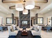 Thumbnail 24 of 25 - Luxurious resident lounge featuring soaring ceilings, designer lighting, and comfortable seating areas for gathering and relaxation.