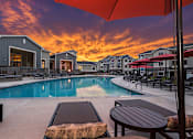 Thumbnail 16 of 16 - Beautiful Sunset at Colorado Springs Apartments with Pool and Deck